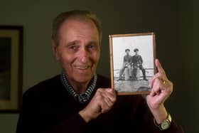 John Brown pictured with a photograph of his brother Flying Officer Walter Brown (right in the Photograph) and his friend Canadian Flying officer Lloyd Berry who were lost in a plane accident in France in World War 11, at his home at Tickhill, Doncaster