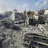 Buildings destroyed by Israeli airstrikes are seen in Gaza City on Tuesday, Oct. 10, 2023. (AP Photo/Hassan Eslaiah)