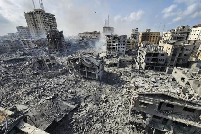 Buildings destroyed by Israeli airstrikes are seen in Gaza City on Tuesday, Oct. 10, 2023. (AP Photo/Hassan Eslaiah)