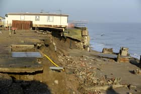 A holiday home and a cliff damaged at Skipsea during the tidal surge