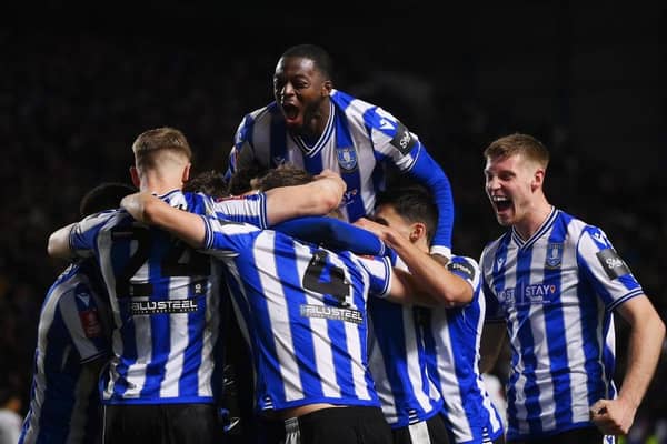 ELATION: Sheffield Wednesday players celebrate Josh Windass's second goal