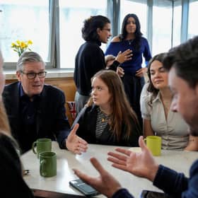 Prime Minister Sir Keir Starmer (left) speaks to local residents during a visit to a community hub at  St Mary's Church in Putney, south west London, to announce immediate action to improve online safety for children. Picture date: Monday February 16, 2026. PA Photo. Photo credit should read: Carlos Jasso/PA Wire