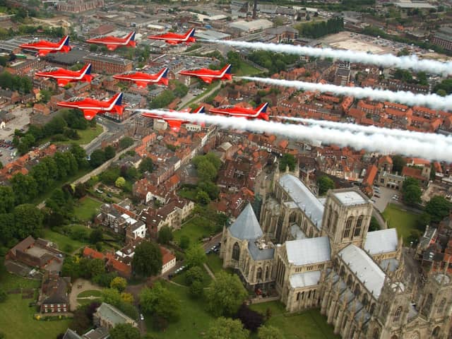 The RAF Red Arrows fly over York Minster.