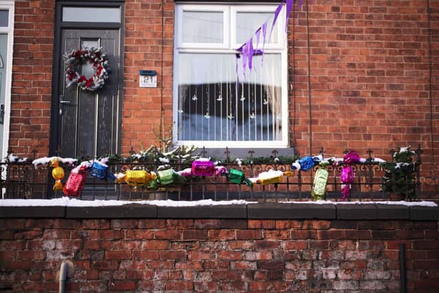 A Sheffield street have decorated their homes in a Quality Streets theme. SWNS