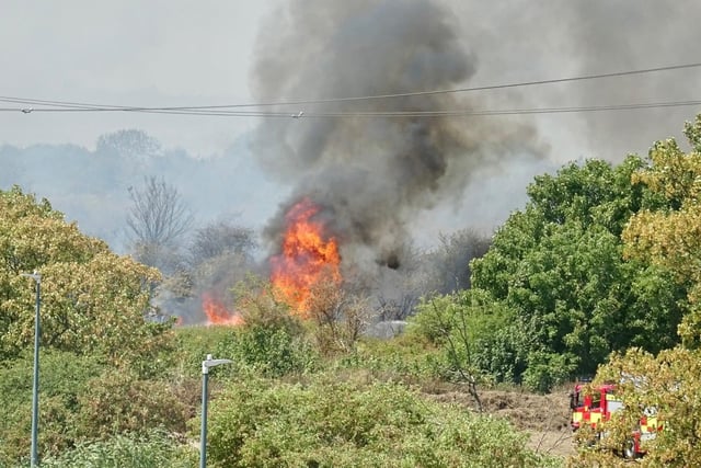 Firefighters attend a fire on Dartford Marshes in Kent. Temperatures have reached 40C for the first time on record in the UK, with 40.2C provisionally recorded at London Heathrow, the Met Office has said.