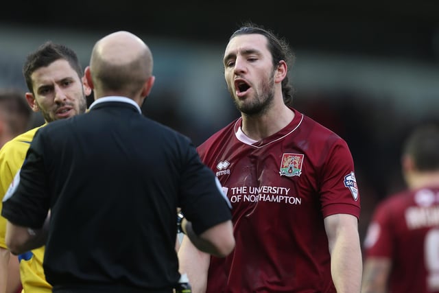 John-Joe O'Toole of Northampton Town makes a point to referee Nicholas Kinseley during the Sky Bet League Two match between Northampton Town and Accrington Stanley at Sixfields Stadium on December 28, 2015.