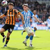 Hull City's Ryan Longman (left) and Huddersfield Town's Ben Jackson battle for the ball during the Sky Bet Championship match at the John Smith's Stadium, Huddersfield. Picture: Nigel French/PA Wire.