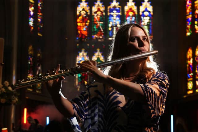 Sarah Bennett of the Leeds-based Paradox Orchestra plays alto flute at Leeds Minster during a concert aimed at highlighting diminishing musical opportunities for young people thanks to cuts in classical music education and the arts. (Photo: Lorne Campbell / Guzelian)