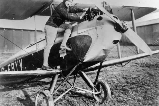 circa 1933:  British aviator Amy Johnson, climbing into her bi-plane.  (Photo by Hulton Archive/Getty Images)