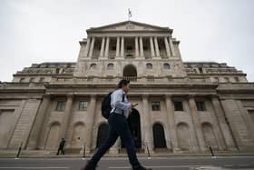 A man walks past the Bank of England in the city of London after sterling hit its lowest level against the dollar since decimalisation in 1971. The pound fell by more than 4 percent to just 1.03 dollars in early Asia trading before rebounding to 1.09 dollars on Monday afternoon as speculation mounted over an intervention by the Bank of England, with officials there understood to be considering making an emergency statement this afternoon. Picture date: Monday September 26, 2022. PA Photo. See PA story POLITICS BUdget. Photo credit should read: Yui Mok/PA Wire