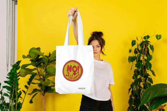 A tote bag from the new merchandise line by Women's Aid.