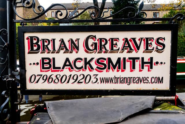 Blacksmith Brian Greaves, works from his narrowboat called ' Emily' and barge 'called Bronte'