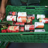 A basket of food items at a food bank. PIC: Jonathan Brady/PA Wire