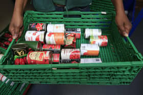A basket of food items at a food bank. PIC: Jonathan Brady/PA Wire