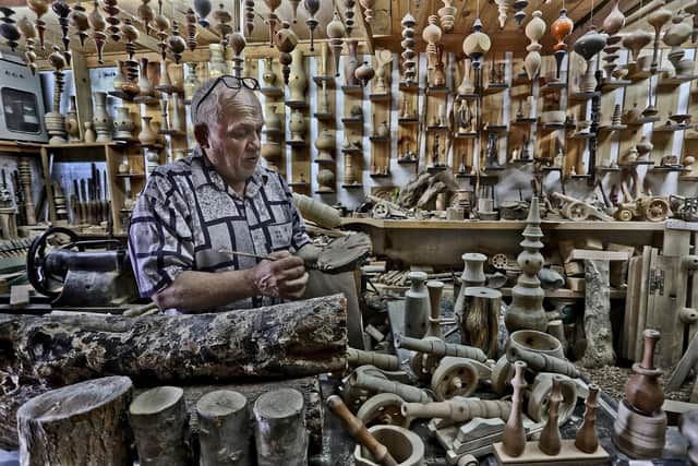 Woodcarver Gaza City by Mohammed Asad.