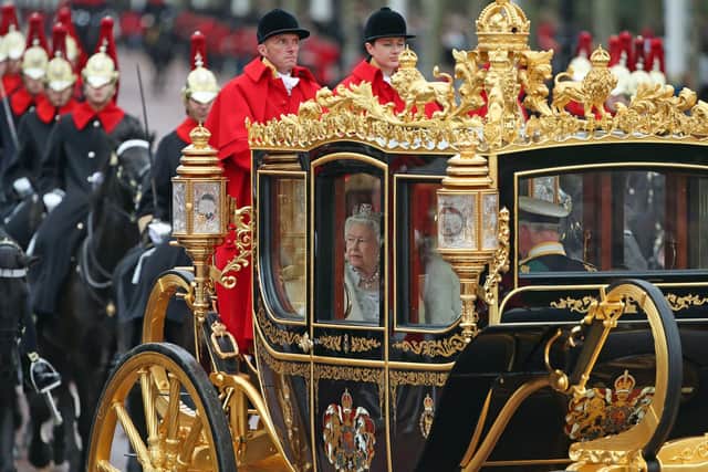 Queen Elizabeth II, accompanied by the Duke and Duchess of Cornwall, returns to Buckingham Palace, London, in the Diamond Jubilee State Coach, having delivered The Queen's Speech. PA Photo. Picture date: Monday October 14, 2019. Photo credit should read: Yui Mok/PA Wire