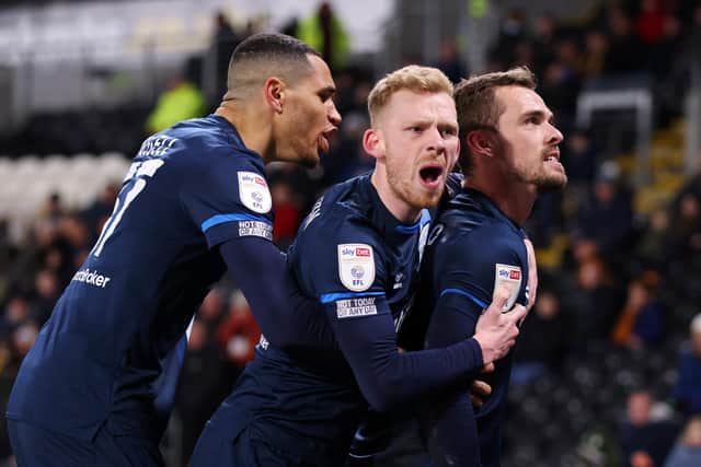 HULL, ENGLAND - APRIL 01: Harry Toffolo (right) celebrates with Lewis O'Brien (centre) after scoring for Huddersfield Town on their run to the play-offs last season (Photo by George Wood/Getty Images)