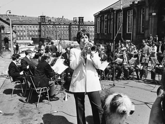 Paul McCartney plays trumpet playing with Black dyke mills brass band accompanied by Martha the Old English sheepdog in Saltaire June 1968
Picture:
(Trinity Mirror / Mirrorpix / Alamy Stock Photo).