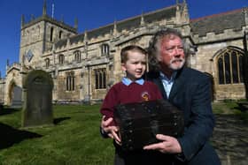 Snaith marks its 800th Anniversary of being granted its Market Charter.
Pictured town mayor Coun Steve Jones with his grandson Zach Jones and the time capsule at Snaith Priory.
Photographed by Yorkshire Post photographer Jonathan Gawthorpe.
