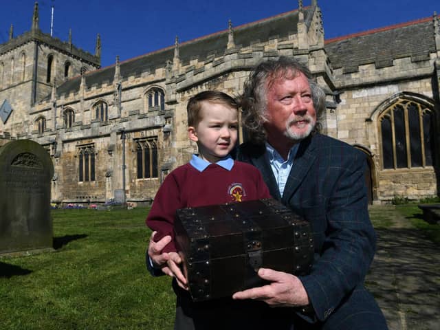 Snaith marks its 800th Anniversary of being granted its Market Charter.
Pictured town mayor Coun Steve Jones with his grandson Zach Jones and the time capsule at Snaith Priory.
Photographed by Yorkshire Post photographer Jonathan Gawthorpe.