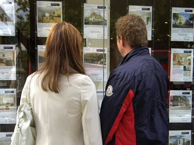 A couple outside an estate agent's window. PIC: Tim Ireland/PA Wire