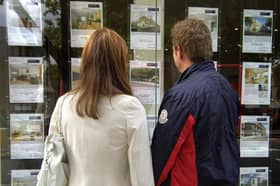 A couple outside an estate agent's window. PIC: Tim Ireland/PA Wire