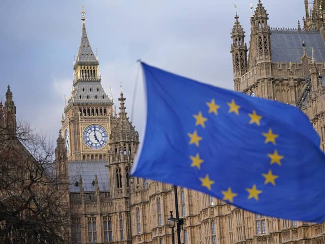 A European Union flag flies in front of the Houses of Parliament in Westminster, London. PIC: PA