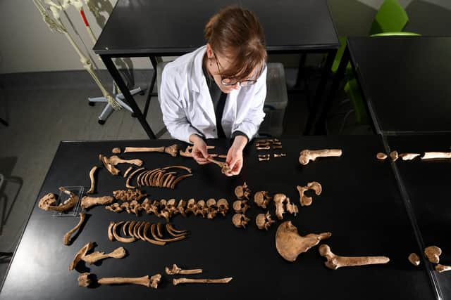 Nina Maaranen human Osteology teaching technician is pictured with the remains of the anchoress, of York Barbican
Simon Hulme