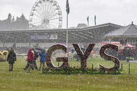 A heavy downpour sends visitors running for cover on the first day of the Great Yorkshire Show. (Pic credit: Tony Johnson)