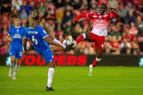 Barnsley's Devante Cole challenges Peterborough United's Romoney Critchlow in the League One game at Oakwell in August. Picture: Bruce Rollinson.