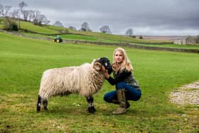 Farmer/Shepherdess Heather Challis, 27, of Halfway House Farm, Middlesmoor, Lofthouse, near Pateley Bridge, North Yorkshire, holding a Dalesbred Tup Hog. Picture By Yorkshire Post Photographer,  James Hardisty. Date:20th March 2023.