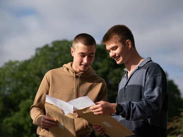Tom Benton (left) and Finlay Dunn receives their A-level results at Langley School in Loddon, Norfolk.