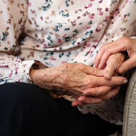 A lady holds hands with her daughter. PIC: Andrew Matthews/PA Wire
