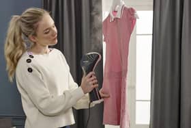 The clothes steamer in action.