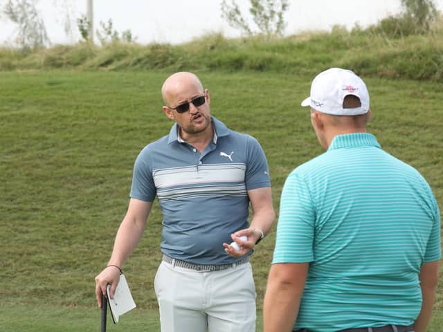 Guidance: Duncan McCarthy, left, chats with his client Marcus Armitage at the recent Abu Dhabi Golf Championship on the DP World Tour. (Picture: Kevin Murray)