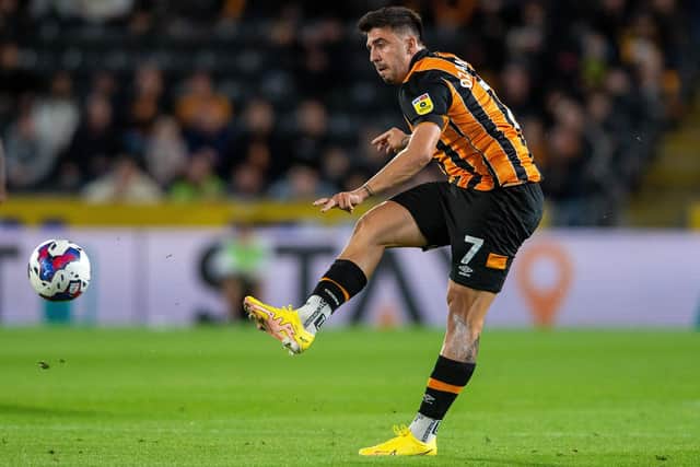 Spot on: Ozan Tufan scored the only goals from the penalty spot as Hull City dented Watford's play-off ambitions (Picture: Bruce Rollinson)