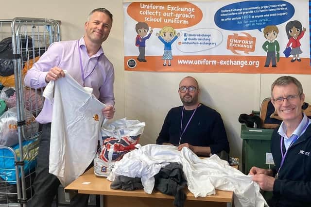 Volunteers from Huddersfield chemical company Lubrizol sorting at Uniform Exchange are (from left) senior plant manager Paul Mellor, production manager Chris Hart-Jones and production planner Paul Burke.