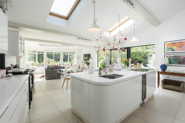 The open plan kitchen/living area with views onto the garden