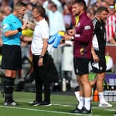Referee Robert Jones is confronted by Jesse Marsch, manager of Leeds United, on the touchline at Brentford. Picture: Steve Bardens/Getty Images.