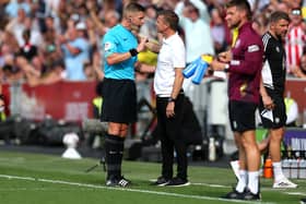 Referee Robert Jones is confronted by Jesse Marsch, manager of Leeds United, on the touchline at Brentford. Picture: Steve Bardens/Getty Images.