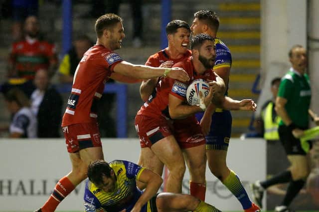 Hull KR's Sam Royle celebrates scoring their fifth try against Warrington Wolves on Friday night. Picture by Ed Sykes/SWpix.com