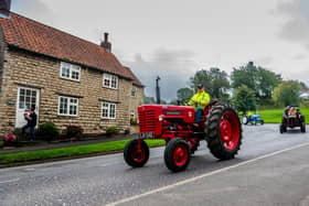 Tractor driver arriving in Hovingham, their first stop of the day.