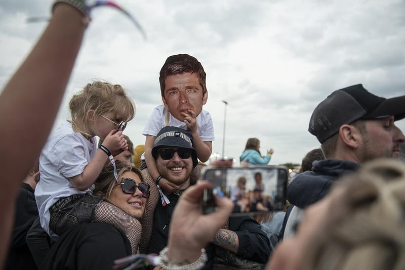 A Noel Gallagher fan wore a mask of his face among the crowd.