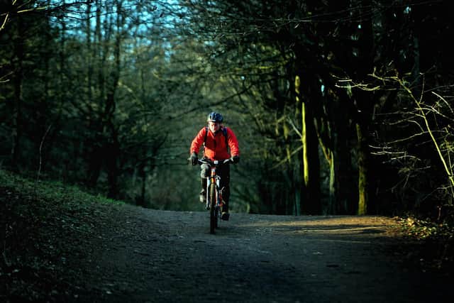 Leeds City Council is proposing to introduce parking fees at sites across the city, with charges starting at 40p-an-hour. Pictured a cyclist rides his mountain bike through Otley Chevin Country Park. Picture Tony Johnson.
