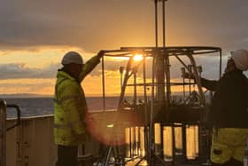 National Marine Facilities crew deploy a multi-core equipment from the RRS discovery at dawn in the Irish Sea. Credit: Will Homoky, University of Leeds.