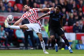 AT A STRETCH: Mehdi Leris of Stoke City controls the ball and holds off Jaheim Headley