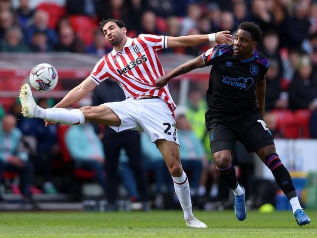 AT A STRETCH: Mehdi Leris of Stoke City controls the ball and holds off Jaheim Headley