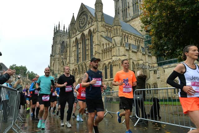 Runners run past York Minster during the Run For All 2021 Yorkshire Marathon. (Picture: Jonathan Gawthorpe)