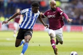 Sheffield Wednesday's Fisayo Dele-Bashiru (left) and Derby County's David McGoldrick battle for the ball (Picture: Richard Sellers/PA Wire)