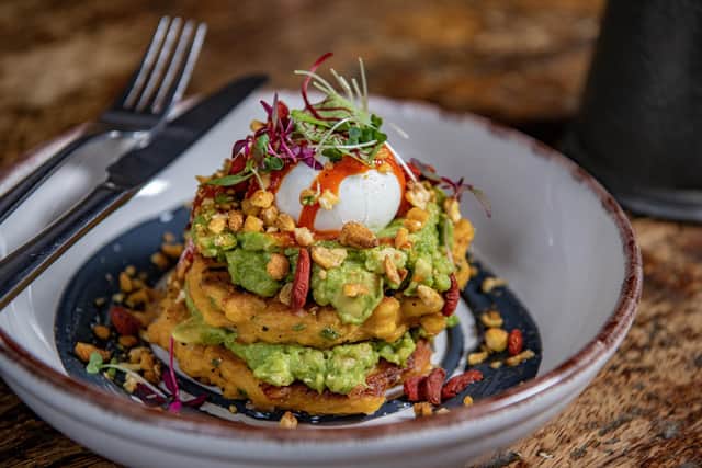 Corn fritters -
Corn, chilli & chive fritters with charcoal yoghurt, smashed avocado, goji berries and a poached egg. Topped with crunchy salted corn & a red pepper, lime and chilli dressing
Picture by Tony Johnson